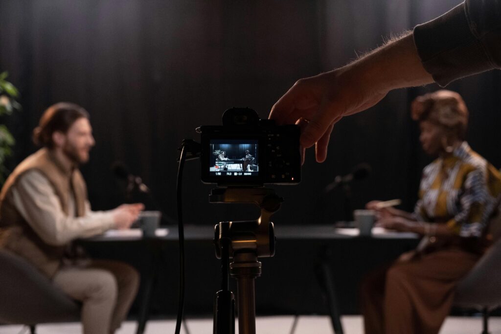 Professional podcast session recording with diverse hosts in studio.